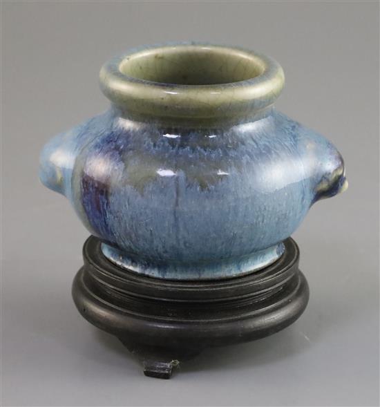 A Chinese Junyao type purple splashed jar, Qing dynasty, W. 10.3cm, wood stand
